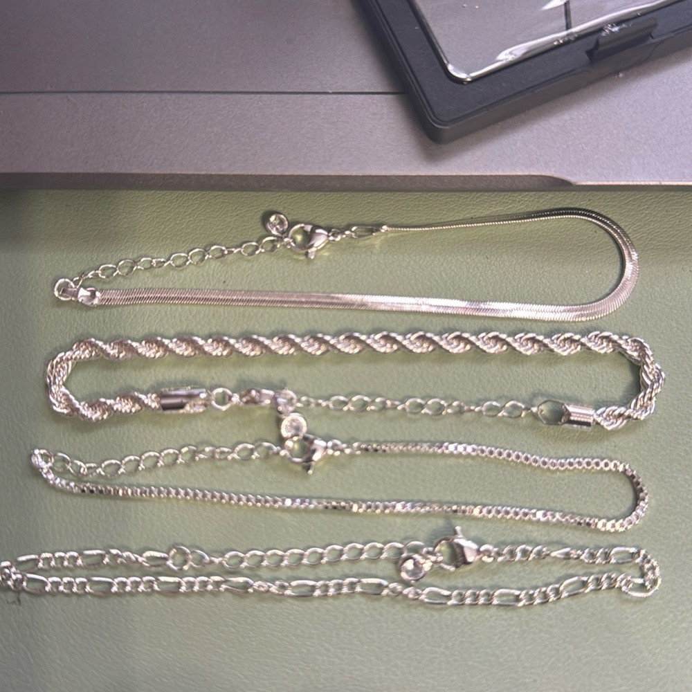 Set of 4 silver bracelets- new